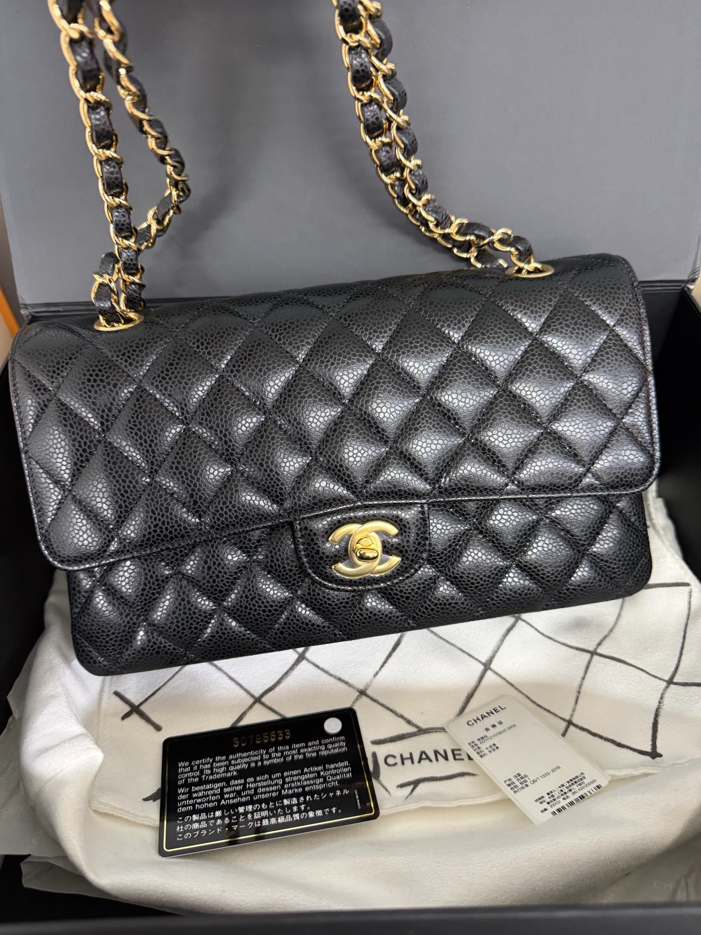 Chanel Medium Classic Flap in Black Caviar with Gold Hardware. 30-series.