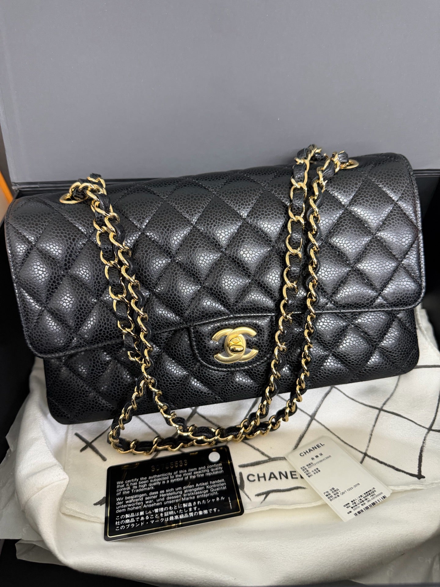 Chanel Medium Classic Flap in Black Caviar with Gold Hardware. 30-series.