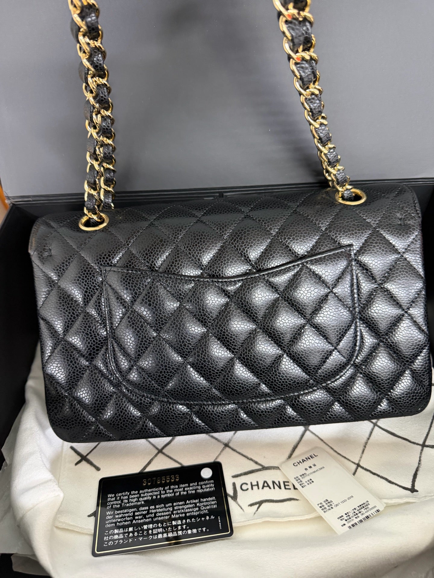 Chanel Medium Classic Flap in Black Caviar with Gold Hardware. 30-series.