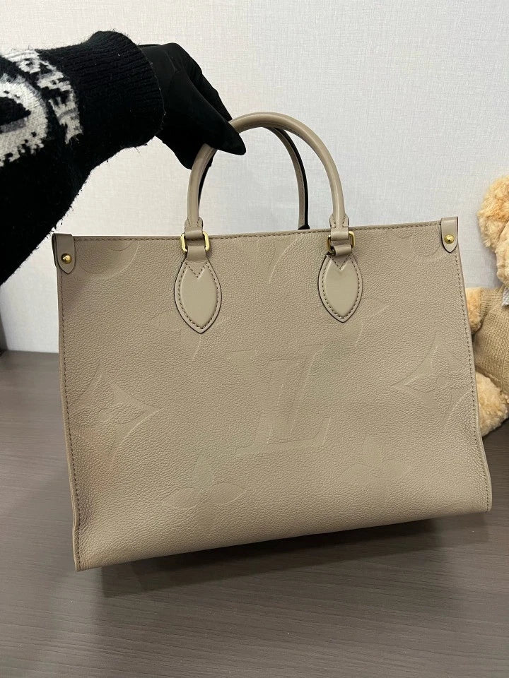 Louis Vuitton Embossed Leather MM OnTheGo Tote Bag For Women