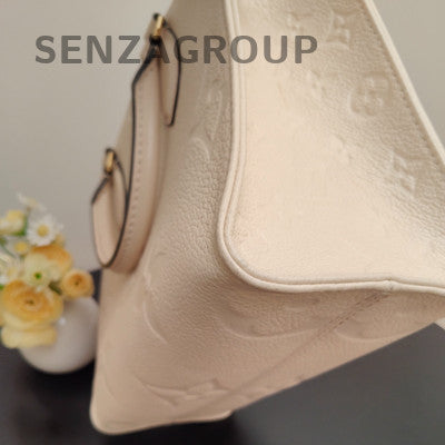 Louis Vuitton Onthego Monogram Empreinte Leather Tote Bag - White