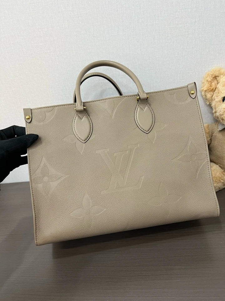 Louis Vuitton Embossed Leather MM OnTheGo Tote Bag For Women
