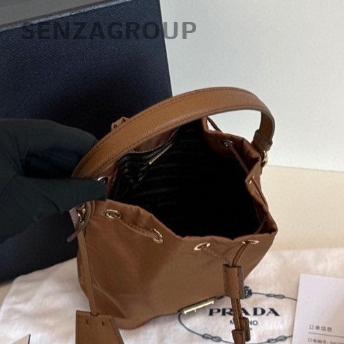 Prada Re-EditionRe-Nylon Mini Bucket Top Handle Bag Crossbody Brown Gold Women