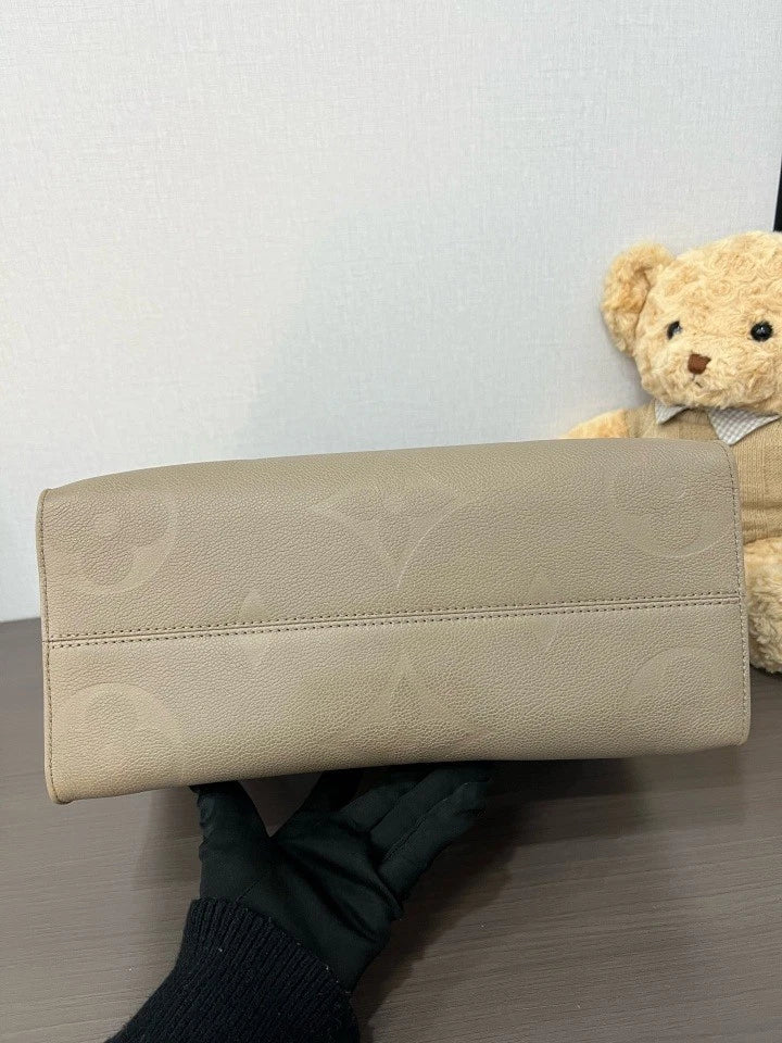 Louis Vuitton Embossed Leather MM OnTheGo Tote Bag For Women