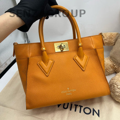 Louis Vuitton Orange Handbag with Gold Buckle - Classic & Stylish Women's Bag