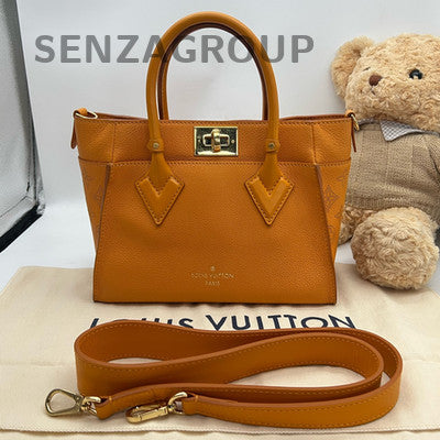 Louis Vuitton Orange Handbag with Gold Buckle - Classic & Stylish Women's Bag