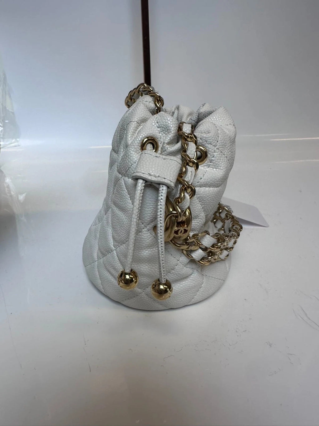 SJ0001 XP00108 Chanel 22K Mini Bucket Bag in White Caviar Leather