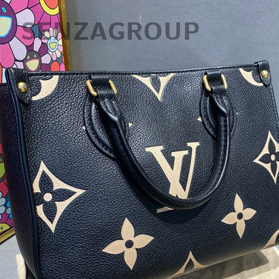 Louis Vuitton OnTheGo MM Monogram Empreinte Leather Tote Bag Black White