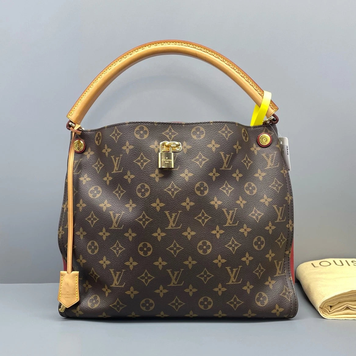 Louis Vuitton Gaia Monogram Canvas Brown Handbag Gold Hardware