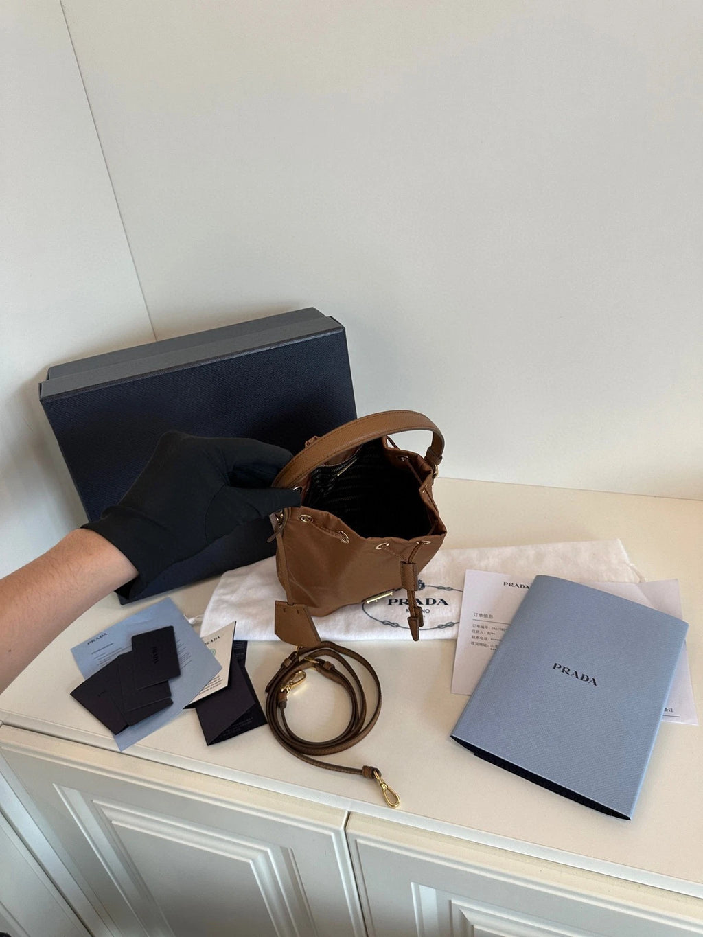 Prada Re-Edition Re-Nylon Mini Bucket Bag Gold Brown Drawstring Parachute