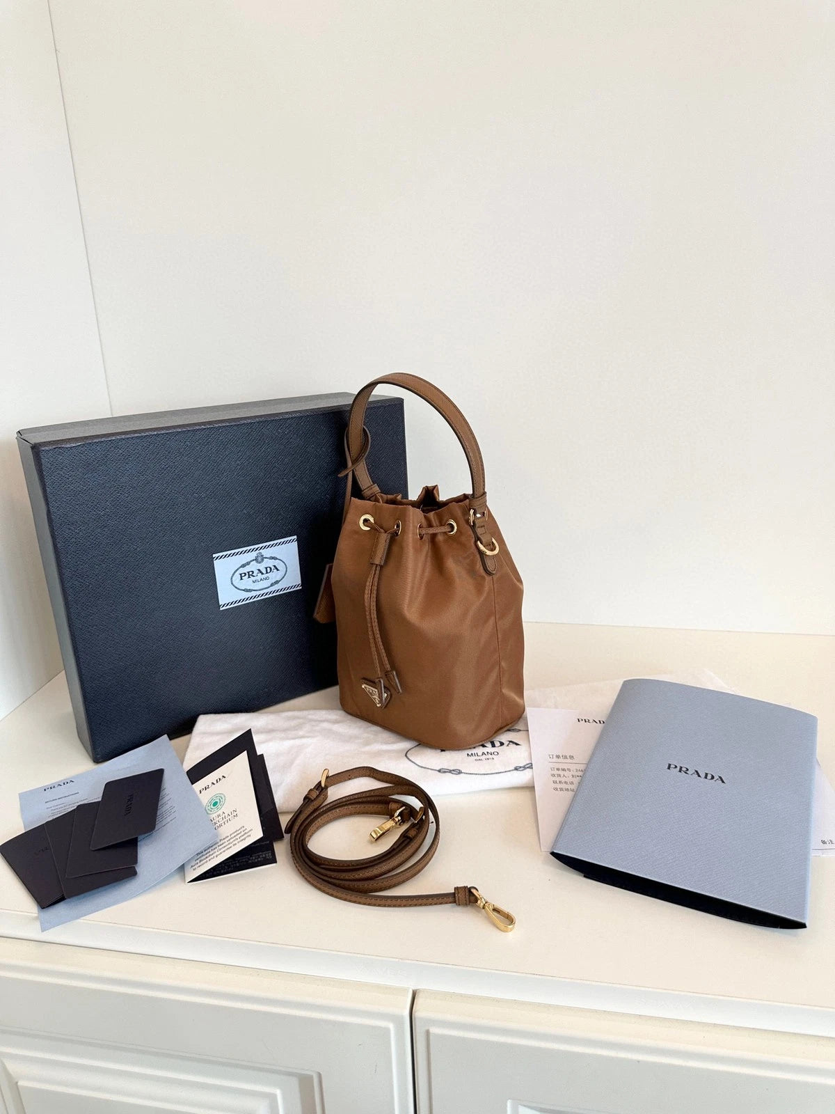 Prada Re-Edition Re-Nylon Mini Bucket Bag Gold Brown Drawstring Parachute